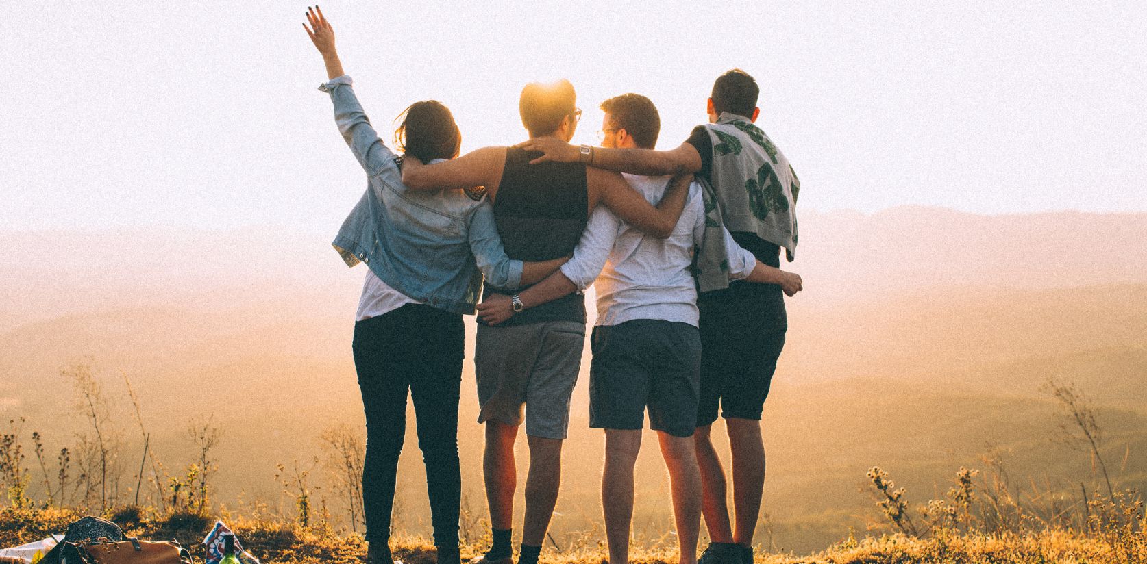 Group of people standing hugging